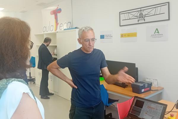 An instructor presents the training centre to a visitor